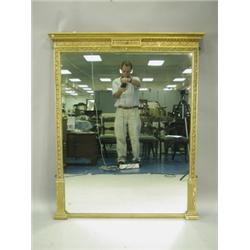 A 19th Century gilt framed wall mirror, with moulded 'classical' decoration, 140cm high x 115c...