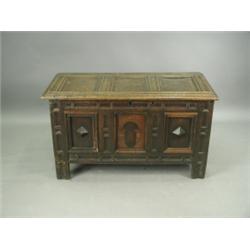 A late 17th/early 18th Century oak coffer with a geometric moulded 3 panel front, (some mouldi...