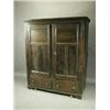 Image 1 : An 18th Century oak wardrobe with a carved frame, and plain panelled doors, over two bottom drawe...