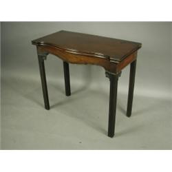 A George III mahogany teatable, the serpentine top with a hinged leaf over a bead edged frieze...