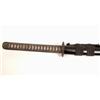 Image 1 : A Japanese Katana, with black cord bound fish skin handle, pierced dragon tsuba, and black lacque...
