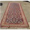 Image 1 : A Persian Rug, with central floral design on a blue ground approx  140 x 300 cm...