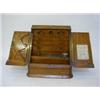 Image 1 : AN EDWARDIAN OAK STATIONERY CABINET, twin sloping doors opening to an arrangement of compartments...