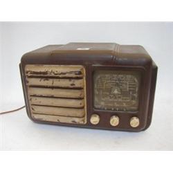 A RAYMOND ELECTRIC BROWN BAKELITE RADIO, painted sound grille, width 40cm  30-40...