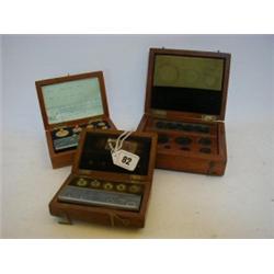 A CASED SERIES OF WEIGHTS, 100grms descending, 'County of Leicester No.406', a similar series, 50...