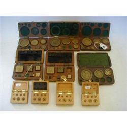 SIX CASES OF BRASS FLAT WEIGHTS, (incomplete), four recent cases and loose weights  30-40...