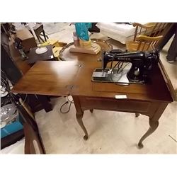 SINGER SEWING MACHINE AND CABINET