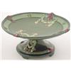 Image 1 : A continental Art Nouveau comport glazed in green and moulded with floral swags, 10in. diam....