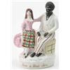 Image 1 : A Victorian Staffordshire figure group, "Eva & Uncle Tom", circa 1855, negro seated beside girl,...