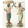 Image 1 : A pair of Austrian earthenware statuettes, negro male and female, one carrying basket over-head,...