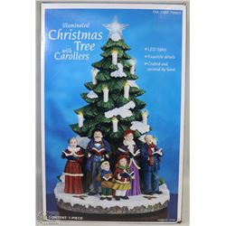 ILLUMINATED CHRISTMAS TREE WITH CAROLERS