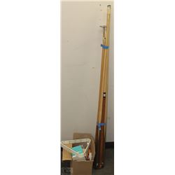 LOT OF 7 POOL CUES, 1 REST, 2 SETS OF BALLS, AND