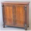 Image 1 : A Regency rosewood side cabinet with two panelled doors enclosing adjustable shelves and a frieze...