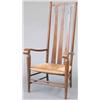Image 1 : An arts and crafts oak high backed low seated occasional chair, with triple arrow splats, rush se...