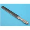 Image 1 : An Edwardian silver handled tortoiseshell paperknife, decorated with lovers in a garden, 1906...