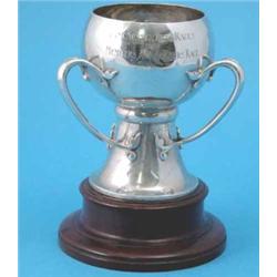 An Edwardian three handled silver trophy cup, with hammered decoration and 'East Sussex Hunt Race...