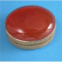 A George III silver gilt and orange agate vinaigrette, of oval form with stamped star decoration...