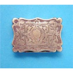 A Victorian silver gilt vinaigrette, of serpentine rectangular form with foliate scroll grille, M...