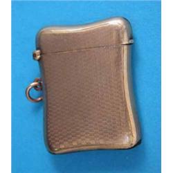 An Edwardian engine turned 9ct gold vesta case....