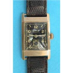 A gentlemans 9ct gold Rotary Maximus wrist watch, with rectangular case and black dial....