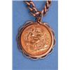 Image 1 : A 1914 half sovereign in pendant mount, on 9ct. gold curb link chain....