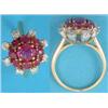Image 1 : A ruby and diamond flowerhead cluster ring claw set in yellow metal....
