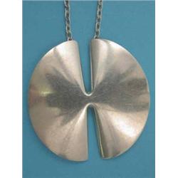 A Georg Jensen silver circular pendant on trace link chain, pattern no: 377A, 2.25ins. dia....