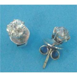 A pair of solitaire diamond earstuds, the old brilliant cut stones claw-set in white metal, estim...