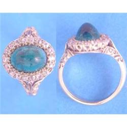 A gold, emerald and diamond ring, the central oval cabochon emerald bordered by a row of diamonds...