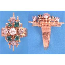 A textured gold dress ring of abstract design set 5 old brilliant cut diamonds and 4 rectangular...