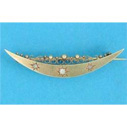 A Victorian gold crescent moon brooch, gypsy set 3 diamonds...
