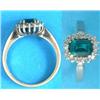 Image 1 : An 18ct white gold ring, set with a rectangular cut synthetic emerald and white stones...