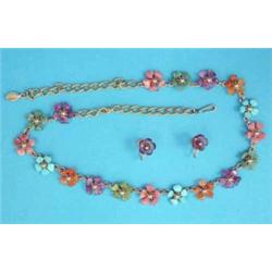 A gilt metal necklace designed as a row of multi coloured gemstone flowerheads, together with a p...
