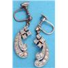 Image 1 : A pair of diamond set scroll design white metal drop earrings....