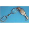 Image 1 : A Continental silver gilt lorgnette with foliate chased handle....