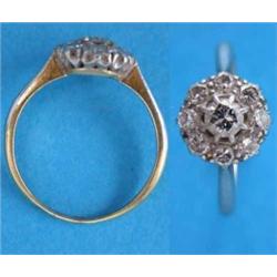 An 18ct. gold 9-stone diamond circular cluster ring....