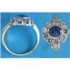 Image 1 : An 18ct. gold sapphire and diamond oval cluster ring....