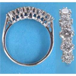 An 18ct. white gold 5-stone diamond half hoop ring....