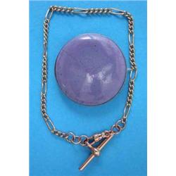 A Ruskin lavender blue glazed pottery circular brooch in plain silver frame....