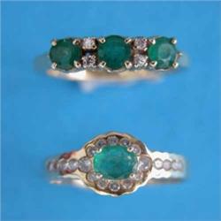 An 18ct. gold ring claw set with 3 emeralds spaced by 2 pairs of diamonds, together with another...