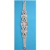 Image 1 : An important 1950's diamond and platinum bracelet of scroll design, the centre panel collet set w...