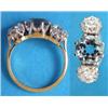 Image 1 : An 18ct. gold 3-stone aquamarine and diamond ring claw set with a round cut aquamarine flanked by...