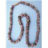 Image 1 : A single row necklace of graduated polished agate and amethyst beads, 18 ins....