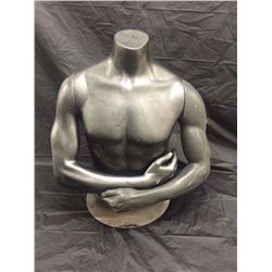 Mannequin torso, male, on a stand.