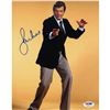 Image 1 : Roger Moore Signed James Bond Posing W/ Yellow Backround 8X10 Photo (PSA/DNA)