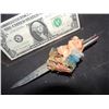 Image 1 : CHILD'S PLAY 2 SCREEN USED KNIFE FROM CHUCKY'S ARM WITH FLESH SHIRT SWATCH AND TAPE STILL ATTATCHED