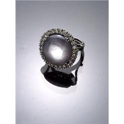 Tested Platinum, Blue Star Sapphire and Diamond Dinner Ring, Set with one round cabochon sapphi...