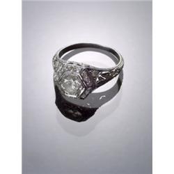 Art Deco Filigree Platinum and Solitaire Diamond Ring, Circa 1920, Set with one round old Eur...