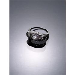 Art Deco Tested Platinum and Diamond Dinner Ring, Circa 1920, Set with three round old mine c...