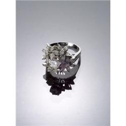 18-Karat White Gold and Diamond Dinner Ring, Set with one round brilliant cut diamond weighing...